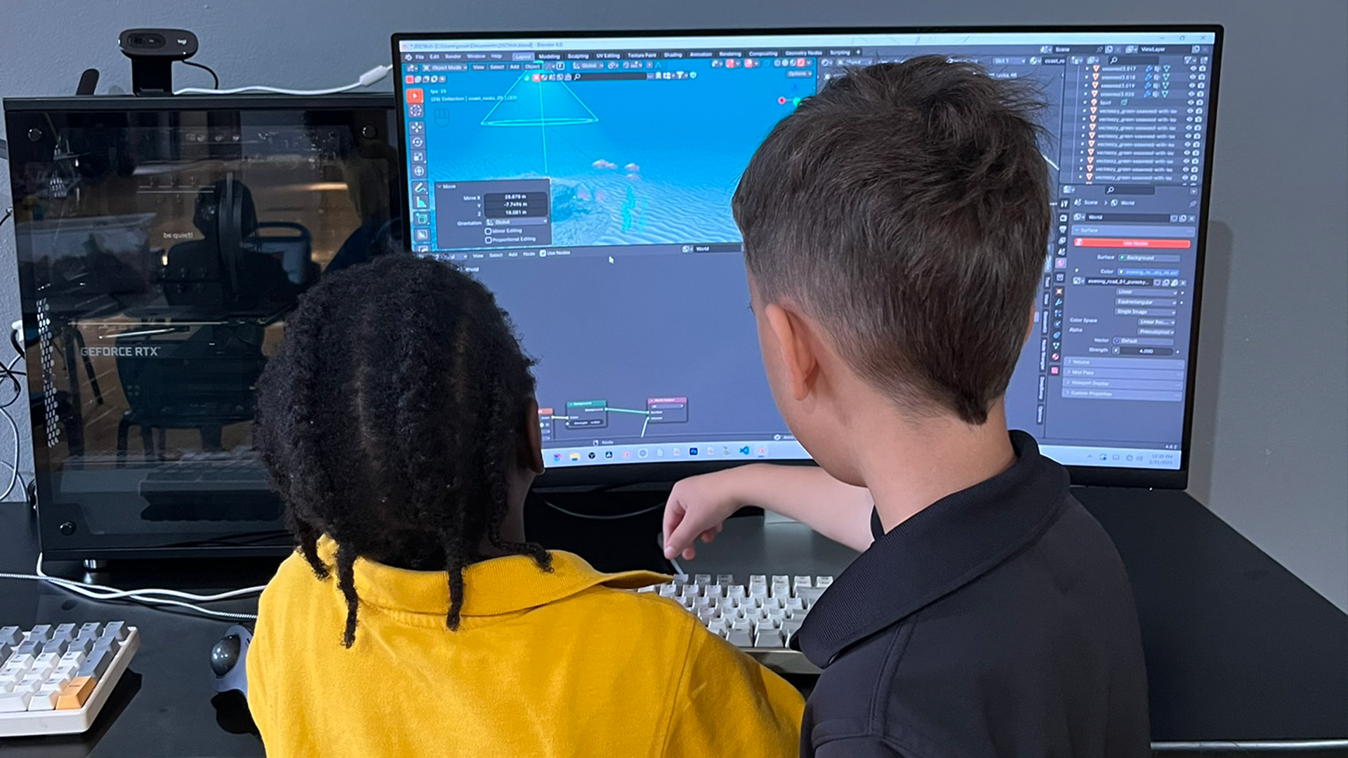 Student using dual monitors for design